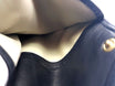 Portatabacco Floppypipe in vera pelle nera, artigianale, con interno chiaro e chiusura a bottone, Made in Italy.