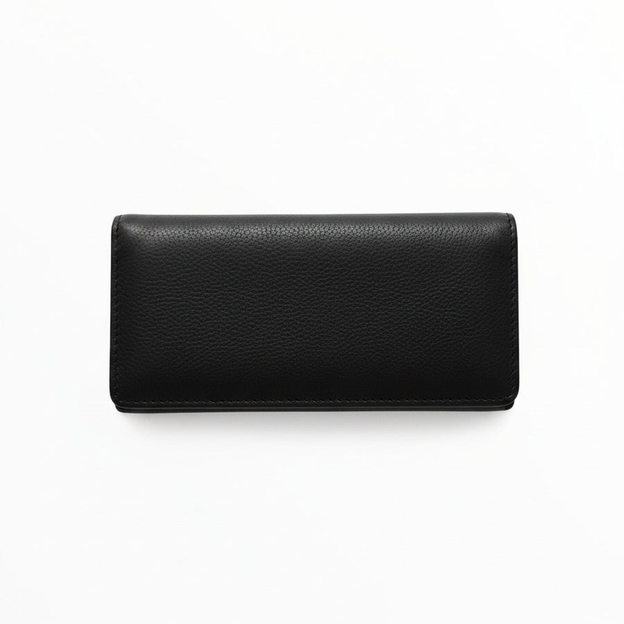 Portatabacco Floppypipe medio avvolgibile in vera pelle nera artigianale, design elegante e compatto.