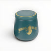 Set Floppypipe Sherlock Holmes in ceramica verde ottanio con vaso per tabacco, battipipa e posapipe con dettagli dorati